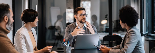 An image of a small group of people discussing case management