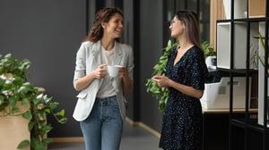 Happy Women chatting in office